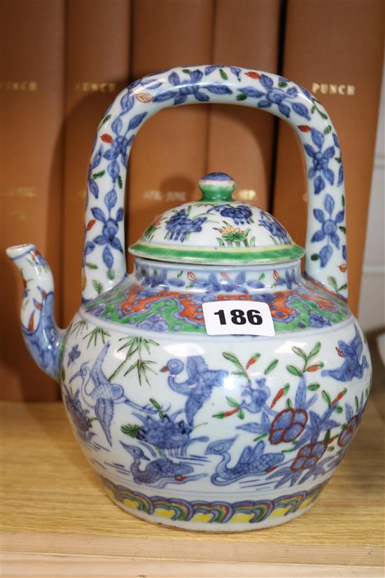 Two Chinese teapots and a cup and saucer Tallest teapot 23cm